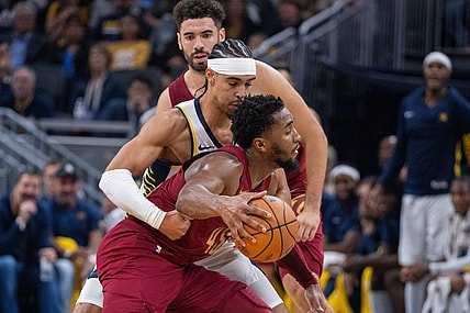 Oct 20, 2023; Indianapolis, Indiana, USA; Cleveland Cavaliers guard Donovan Mitchell (45) dribbles the ball while Indiana Pacers guard Andrew Nembhard (2) defends  in the second half at Gainbridge Fieldhouse. Mandatory Credit: Trevor Ruszkowski-USA TODAY Sports
