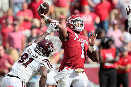 Oct 21, 2023; Fayetteville, Arkansas, USA;  Mississippi State Bulldogs defensive end Deonte Anderson (91) hits the arm of Arkansas Razorbacks quarterback KJ Jefferson (1) during the second half by at Donald W. Reynolds Razorback Stadium. Mississippi State won 7-3. Mandatory Credit: Nelson Chenault-USA TODAY Sports