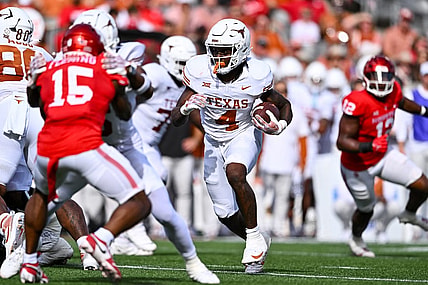 Oct 21, 2023; Houston, Texas, USA; Texas Longhorns running back CJ Baxter (4) runs the ball during the second quarter against the Houston Cougars at TDECU Stadium. Mandatory Credit: Maria Lysaker-USA TODAY Sports