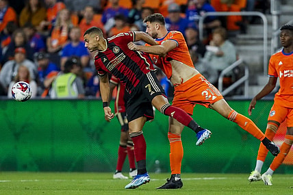 Oct 21, 2023; Cincinnati, Ohio, USA; Atlanta United FC forward Giorgos Giakoumakis (7) battles for the ball against FC Cincinnati defender Matt Miazga (21) in the second half at TQL Stadium. Mandatory Credit: Katie Stratman-USA TODAY Sports
