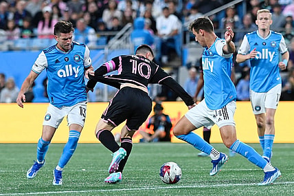 Oct 21, 2023; Charlotte, North Carolina, USA; Charlotte FC midfielder Brandt Bronico (13) battles for the ball against Inter Miami CF forward Lionel Messi (10) against Charlotte FC midfielder Andrew Privett (34) during the first half at Bank of America Stadium. Mandatory Credit: Griffin Zetterberg-USA TODAY Sports