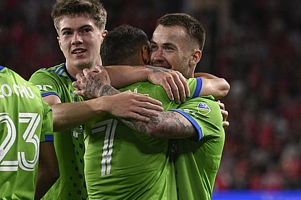 Oct 21, 2023; St. Louis, Missouri, USA; Seattle Sounders midfielder Cristian Roldan (7) congratulates Seattle Sounders midfielder Albert Rusnak (11) after Rusnak scored a goal against St. Louis City in the first half at CITYPARK. Mandatory Credit: Joe Puetz-USA TODAY Sports