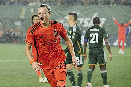 Oct 21, 2023; Portland, Oregon, USA; Houston Dynamo midfielder Griffin Dorsey (25) celebrates after scoring a goal in the second half against the Portland Timbers at Providence Park. Mandatory Credit: Troy Wayrynen-USA TODAY Sports