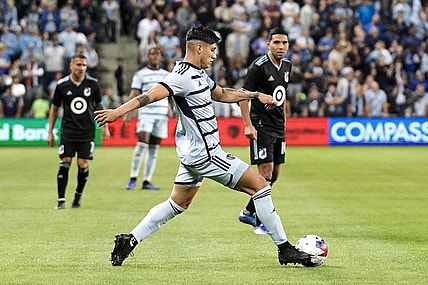 Oct 21, 2023; Kansas City, Kansas, USA; Sporting Kansas City forward Alan Pulido (9) dribbles the ball against Minnesota United during the second half at Children's Mercy Park. Mandatory Credit: Denny Medley-USA TODAY Sports