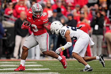 Oct 21, 2023; Columbus, Ohio, USA; Ohio State Buckeyes running back Miyan Williams (3) runs past Penn State Nittany Lions running back DK Kency (25) during the NCAA football game at Ohio Stadium.