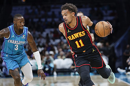 Oct 25, 2023; Charlotte, North Carolina, USA;  Atlanta Hawks guard Trae Young (11) drives around Charlotte Hornets guard Terry Rozier (3) during the first quarter at Spectrum Center. Mandatory Credit: Nell Redmond-USA TODAY Sports