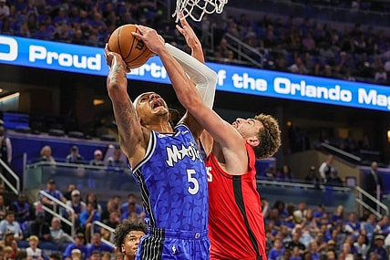 Oct 25, 2023; Orlando, Florida, USA; Orlando Magic forward Paolo Banchero (5) is fouled by Houston Rockets center Alperen Sengun (28) during the first quarter at Amway Center. Mandatory Credit: Mike Watters-USA TODAY Sports