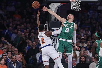 Oct 25, 2023; New York, New York, USA; Boston Celtics center Kristaps Porzingis (8) blocks a shot taken by New York Knicks guard RJ Barrett (9) in the first quarter at Madison Square Garden. Mandatory Credit: Wendell Cruz-USA TODAY Sports