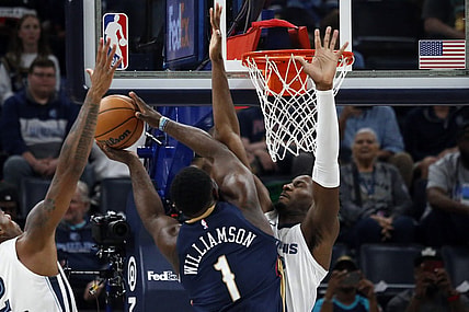 Oct 25, 2023; Memphis, Tennessee, USA; Memphis Grizzlies forward-center Jaren Jackson Jr. (13) defends as New Orleans Pelicans forward Zion Williamson (1) drives to the basket during the first half at FedExForum. Mandatory Credit: Petre Thomas-USA TODAY Sports
