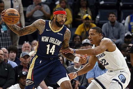 Oct 25, 2023; Memphis, Tennessee, USA; New Orleans Pelicans forward Brandon Ingram (14) catches a pass as Memphis Grizzlies guard Desmond Bane (22) defends during the first half at FedExForum. Mandatory Credit: Petre Thomas-USA TODAY Sports