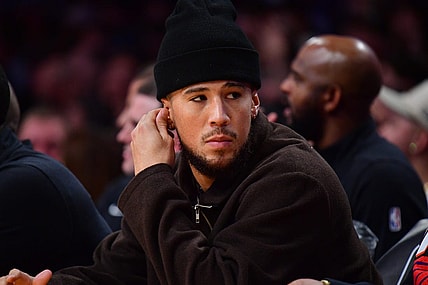 Oct 26, 2023; Los Angeles, California, USA; Phoenix Suns guard Devin Booker (1) watches game action against the Los Angeles Lakers during the first half at Crypto.com Arena. Mandatory Credit: Gary A. Vasquez-USA TODAY Sports