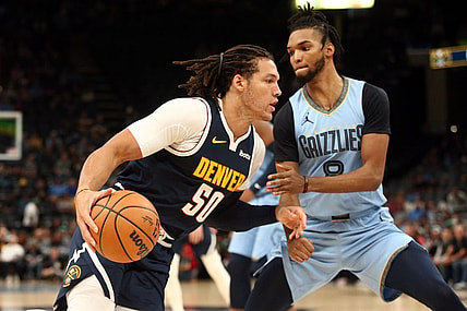 Oct 27, 2023; Memphis, Tennessee, USA; Denver Nuggets forward Aaron Gordon (50) moves to the basket as Memphis Grizzlies forward Ziaire Williams (8) defends during the first half at FedExForum. Mandatory Credit: Petre Thomas-USA TODAY Sports