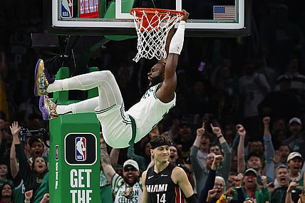 Oct 27, 2023; Boston, Massachusetts, USA; Boston Celtics guard Jaylen Brown (7) shouts out after dunking over Miami Heat guard Tyler Herro (14) during the second quarter at TD Garden. Mandatory Credit: Winslow Townson-USA TODAY Sports