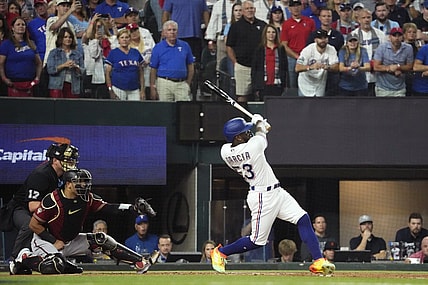 Texas Rangers right fielder Adolis Garcia (53) hits an RBI single during the first inning against the Arizona Diamondbacks in game one of the 2023 World Series at Globe Life Field in Arlington, Texas, on Oct. 27, 2023.