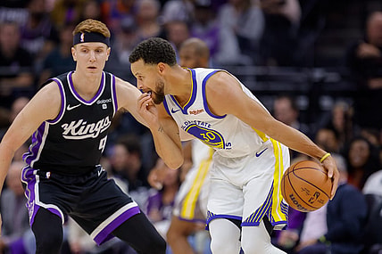 Oct 27, 2023; Sacramento, California, USA; Golden State Warriors guard Stephen Curry (30) dribbles the ball against Sacramento Kings guard Kevin Huerter (9) during the first quarter at Golden 1 Center. Mandatory Credit: Sergio Estrada-USA TODAY Sports
