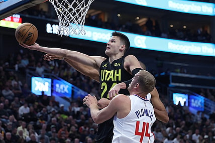 Oct 27, 2023; Salt Lake City, Utah, USA; Utah Jazz center Walker Kessler (24) goes to the basket against Los Angeles Clippers center Mason Plumlee (44) in the second quarter at Delta Center. Mandatory Credit: Rob Gray-USA TODAY Sports