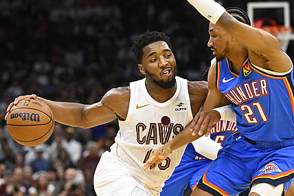 Oct 27, 2023; Cleveland, Ohio, USA; Cleveland Cavaliers guard Donovan Mitchell (45) drives against Oklahoma City Thunder guard Aaron Wiggins (21) in the fourth quarter at Rocket Mortgage FieldHouse. Mandatory Credit: David Richard-USA TODAY Sports