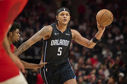Oct 27, 2023; Portland, Oregon, USA; Orlando Magic forward Paolo Banchero (5) passes the ball during the second half against Portland Trail Blazers guard Scoot Henderson (00) at Moda Center. Mandatory Credit: Troy Wayrynen-USA TODAY Sports
