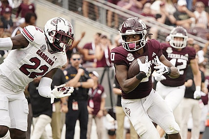 Oct 28, 2023; College Station, Texas, USA; Texas A&M Aggies wide receiver Ainias Smith (0) runs for a touchdown against the South Carolina Gamecocks during the second quarter at Kyle Field. Mandatory Credit: Dustin Safranek-USA TODAY Sports