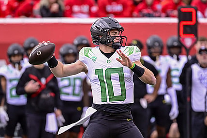 Oct 28, 2023; Salt Lake City, Utah, USA; Oregon Ducks quarterback Bo Nix (10) throws the ball downfield against the Utah Utes during the first half at Rice-Eccles Stadium. Mandatory Credit: Christopher Creveling-USA TODAY Sports
