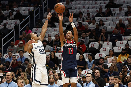 Oct 28, 2023; Washington, District of Columbia, USA; Washington Wizards guard Jordan Poole (13) shoots the ball over Memphis Grizzlies guard Desmond Bane (22) in the first quarter at Capital One Arena. Mandatory Credit: Geoff Burke-USA TODAY Sports