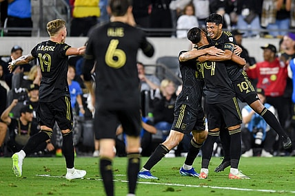 Oct 28, 2023; Los Angeles, CA, USA; Los Angeles FC forward Denis Bouanga (99) celebrates with teammates after scoring a goal against the Vancouver Whitecaps FC in the first half of game one in a round one match of the 2023 MLS Cup Playoffs at BMO Stadium. Mandatory Credit: Jonathan Hui-USA TODAY Sports