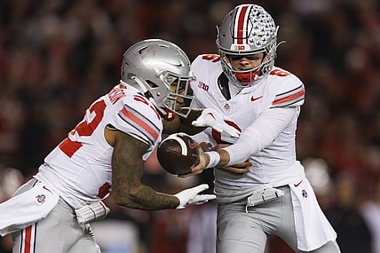 Oct 28, 2023; Madison, Wisconsin, USA;  Ohio State Buckeyes quarterback Kyle McCord (6) hands the football off to running back TreVeyon Henderson (32) during the third quarter against the Wisconsin Badgers at Camp Randall Stadium. Mandatory Credit: Jeff Hanisch-USA TODAY Sports