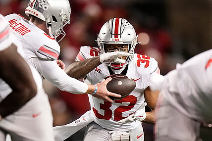 Oct 28, 2023; Madison, Wisconsin, USA; Ohio State Buckeyes quarterback Kyle McCord (6) hands off to running back TreVeyon Henderson (32) during the second half of the NCAA football game against the Wisconsin Badgers at Camp Randall Stadium. Ohio State won 24-10.