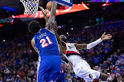 Oct 29, 2023; Philadelphia, Pennsylvania, USA; Philadelphia 76ers center Joel Embiid (21) blocks the drive of Portland Trail Blazers forward Jerami Grant (9) during the second quarter at Wells Fargo Center. Mandatory Credit: Bill Streicher-USA TODAY Sports
