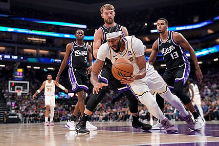 Oct 29, 2023; Sacramento, California, USA; Los Angeles Lakers forward Anthony Davis (3) falls to the ground after being fouled by Sacramento Kings forward Domantas Sabonis (10) in the second quarter at the Golden 1 Center. Mandatory Credit: Cary Edmondson-USA TODAY Sports