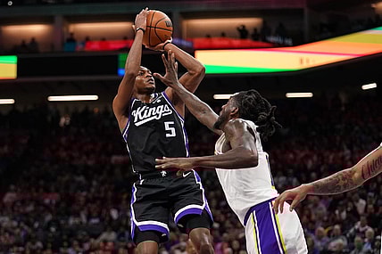 Oct 29, 2023; Sacramento, California, USA; Sacramento Kings guard De'Aaron Fox (5) shoots the ball over Los Angeles Lakers forward Taurean Prince (12) in the fourth quarter at the Golden 1 Center. Mandatory Credit: Cary Edmondson-USA TODAY Sports