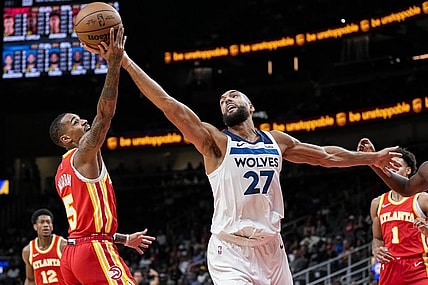 Oct 30, 2023; Atlanta, Georgia, USA; Minnesota Timberwolves center Rudy Gobert (27) and Atlanta Hawks guard Dejounte Murray (5) fight for a rebound during the first half at State Farm Arena. Mandatory Credit: Dale Zanine-USA TODAY Sports