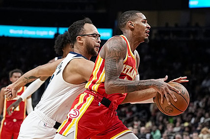 Oct 30, 2023; Atlanta, Georgia, USA; Atlanta Hawks guard Dejounte Murray (5) dribbles past Minnesota Timberwolves forward Kyle Anderson (1) during the second half at State Farm Arena. Mandatory Credit: Dale Zanine-USA TODAY Sports
