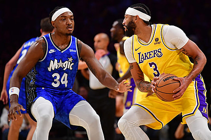 Oct 30, 2023; Los Angeles, California, USA; Los Angeles Lakers forward Anthony Davis (3) moves the ball against Orlando Magic center Wendell Carter Jr. (34) during the first half at Crypto.com Arena. Mandatory Credit: Gary A. Vasquez-USA TODAY Sports