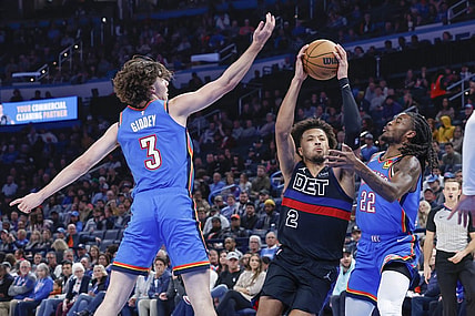 Oct 30, 2023; Oklahoma City, Oklahoma, USA; Detroit Pistons guard Cade Cunningham (2) drives to the basket between Oklahoma City Thunder guard Josh Giddey (3) and guard Cason Wallace (22) during the second half at Paycom Center. Oklahoma City won 124-112. Mandatory Credit: Alonzo Adams-USA TODAY Sports