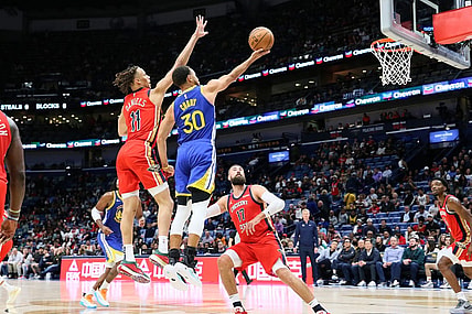 Oct 30, 2023; New Orleans, Louisiana, USA; Golden State Warriors guard Stephen Curry (30) drives to the basket against New Orleans Pelicans guard Dyson Daniels (11) and center Jonas Valanciunas (17) at Smoothie King Center. Mandatory Credit: Matthew Dobbins-USA TODAY Sports