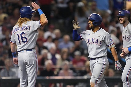 Texas Rangers right fielder Travis Jankowski (16) congratulates second baseman Marcus Semien (2) after a three-run home run during the third inning against the Arizona Diamondbacks in Game 4 of the 2023 World Series at Chase Field in Phoenix, AZ.