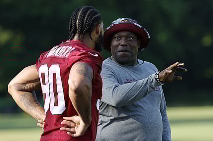 Jun 15, 2022; Ashburn, Virginia, USA; Washington Commanders defensive end Montez Sweat (90) talks with special consultant and NFL Hall of Fame member Warren Sapp (R) on day two of minicamp at The Park. Mandatory Credit: Geoff Burke-USA TODAY Sports