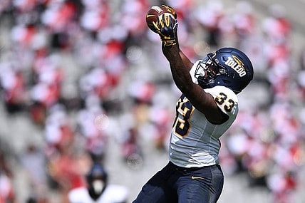 Toledo running back Peny Boone, second in the nation in yards per carry, powers the Rockets into the MAC title game. Mandatory Credit: Orlando Ramirez-USA TODAY Sports