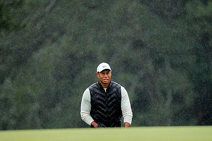 Tiger Woods lines up his putt on the 18th green during the second round of the Masters.

Pga Masters Tournament Completion Of Second Round