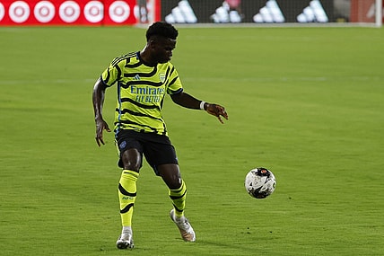 Jul 19, 2023; Washington, DC, USA; Arsenal midfielder Bukayo Saka (7) dribbles the ball against MLS All-Stars in the 2023 MLS All Star Game at Audi Field. Mandatory Credit: Geoff Burke-USA TODAY Sports