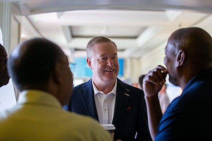 Florida State Athletics Director Michael Alford talks with Tallahassee Chamber of Commerce Conference attendees during a break on Saturday, Aug. 19, 2023.