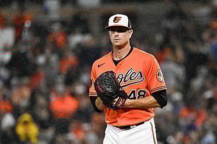 Sep 30, 2023; Baltimore, Maryland, USA;  Baltimore Orioles starting pitcher Kyle Gibson (48) stands on the pitcher's mound as rain falls during the second inning against the Boston Red Sox at Oriole Park at Camden Yards. Mandatory Credit: Tommy Gilligan-USA TODAY Sports