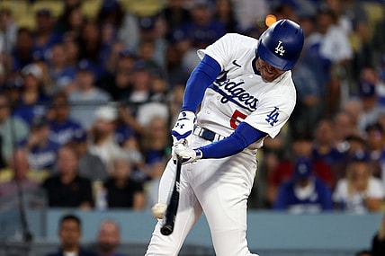 Oct 9, 2023; Los Angeles, California, USA; Los Angeles Dodgers first baseman Freddie Freeman (5) hits a single against the Arizona Diamondbacks in the first inning for game two of the NLDS for the 2023 MLB playoffs at Dodger Stadium. Mandatory Credit: Kiyoshi Mio-USA TODAY Sports