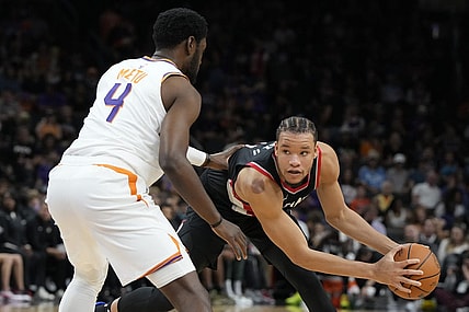 Oct 16, 2023; Phoenix, Arizona, USA; Portland Trail Blazers forward Kevin Knox II (11) looks to drive on Phoenix Suns forward Chimezie Metu (4) in the second half at Footprint Center. Mandatory Credit: Rick Scuteri-USA TODAY Sports
