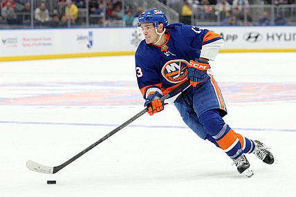 Oct 20, 2023; Elmont, New York, USA; New York Islanders center Mathew Barzal (13) skates with the puck against the New Jersey Devils during overtime at UBS Arena. Mandatory Credit: Brad Penner-USA TODAY Sports