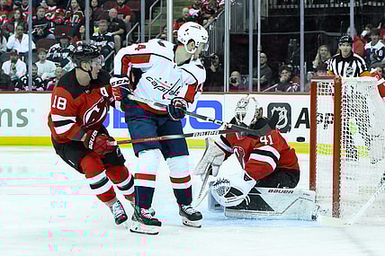 Oct 25, 2023; Newark, New Jersey, USA; Washington Capitals center Connor McMichael (24) scores a goal against New Jersey Devils goaltender Vitek Vanecek (41) during the third period at Prudential Center. Mandatory Credit: John Jones-USA TODAY Sports