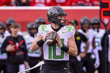 Oct 28, 2023; Salt Lake City, Utah, USA; Oregon Ducks quarterback Bo Nix (10) drops back to pass against the Utah Utes during the first half at Rice-Eccles Stadium. Mandatory Credit: Christopher Creveling-USA TODAY Sports