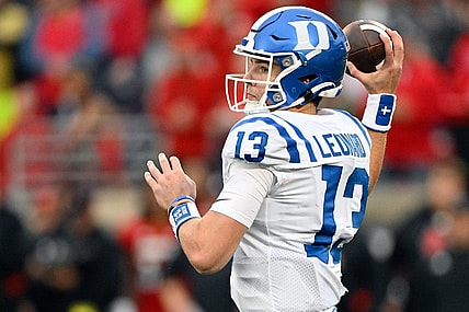 Oct 28, 2023; Louisville, Kentucky, USA;  Duke Blue Devils quarterback Riley Leonard (13) looks to pass the ball against the Louisville Cardinals during the second half at L&N Federal Credit Union Stadium. Mandatory Credit: Jamie Rhodes-USA TODAY Sports