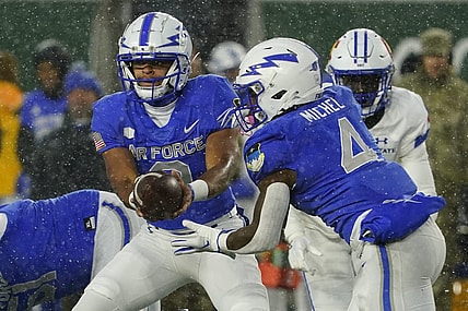 Oct 28, 2023; Fort Collins, Colorado, USA;  Air Force Falcons quarterback Zac Larrier (9) hands off to Air Force Falcons fullback Emmanuel Michel (4) at Sonny Lubick Field at Canvas Stadium. Mandatory Credit: Michael Madrid-USA TODAY Sports